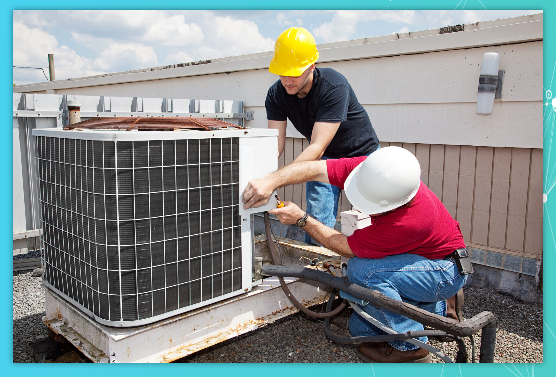 Two workers on the roof of a building working on the air conditioning unit.