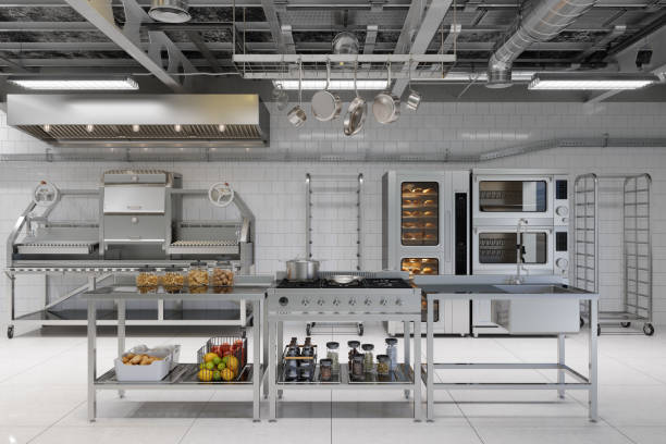 Front View Of Modern Industrial Kitchen Interior With Kitchen Utensils, Equipment And Bakery Products