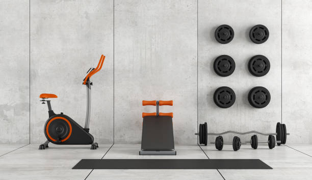 Concrete room with stationary bike, abdominal bench and weight - 3d rendering